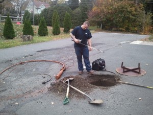 Technician measuring the well depth Well Pump Replacement Connecticut
