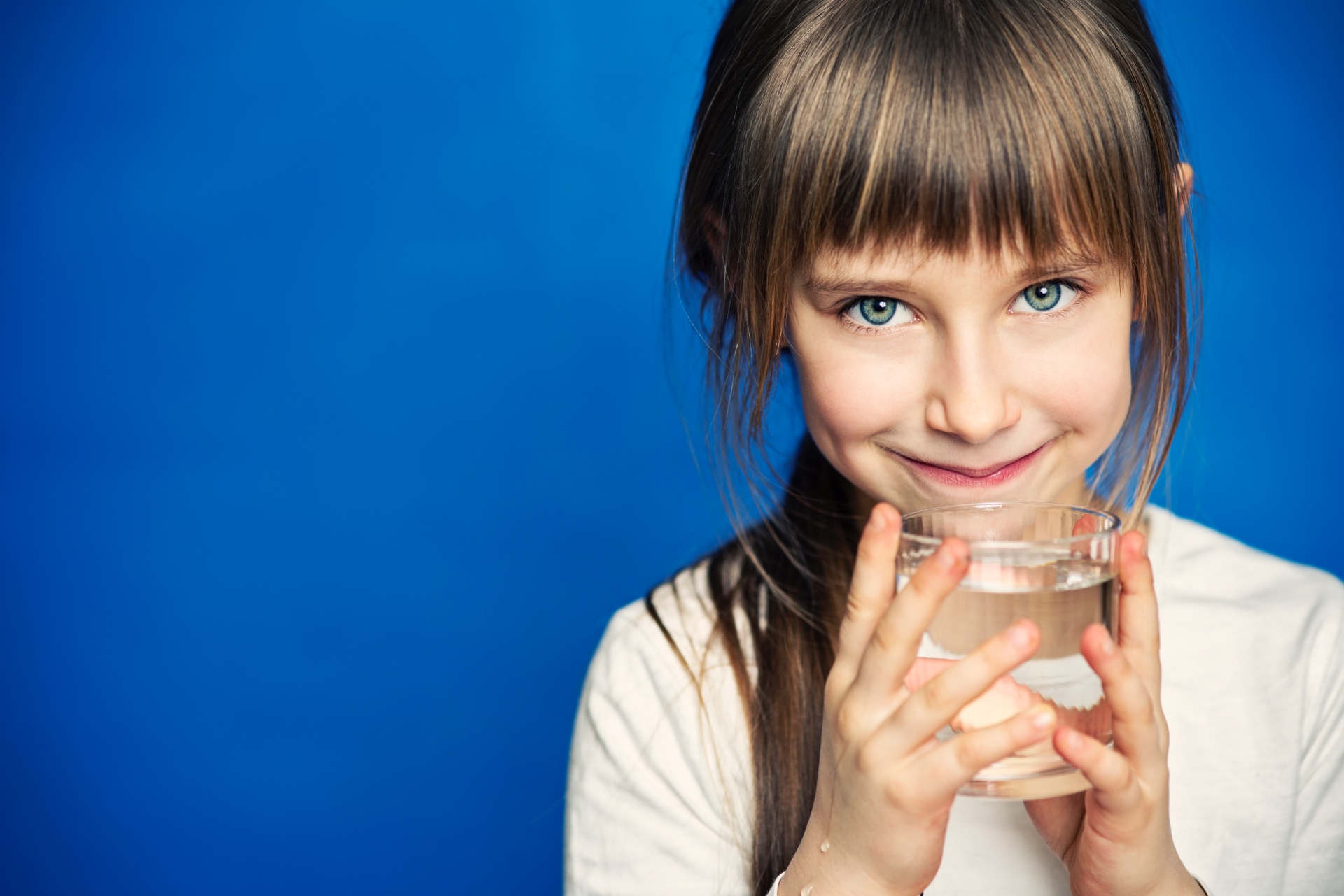 GIRL HOLDING GLASS OF WATER iStock-174868342 GIRL HOLDING GLASS OF WATER iStock-174868342