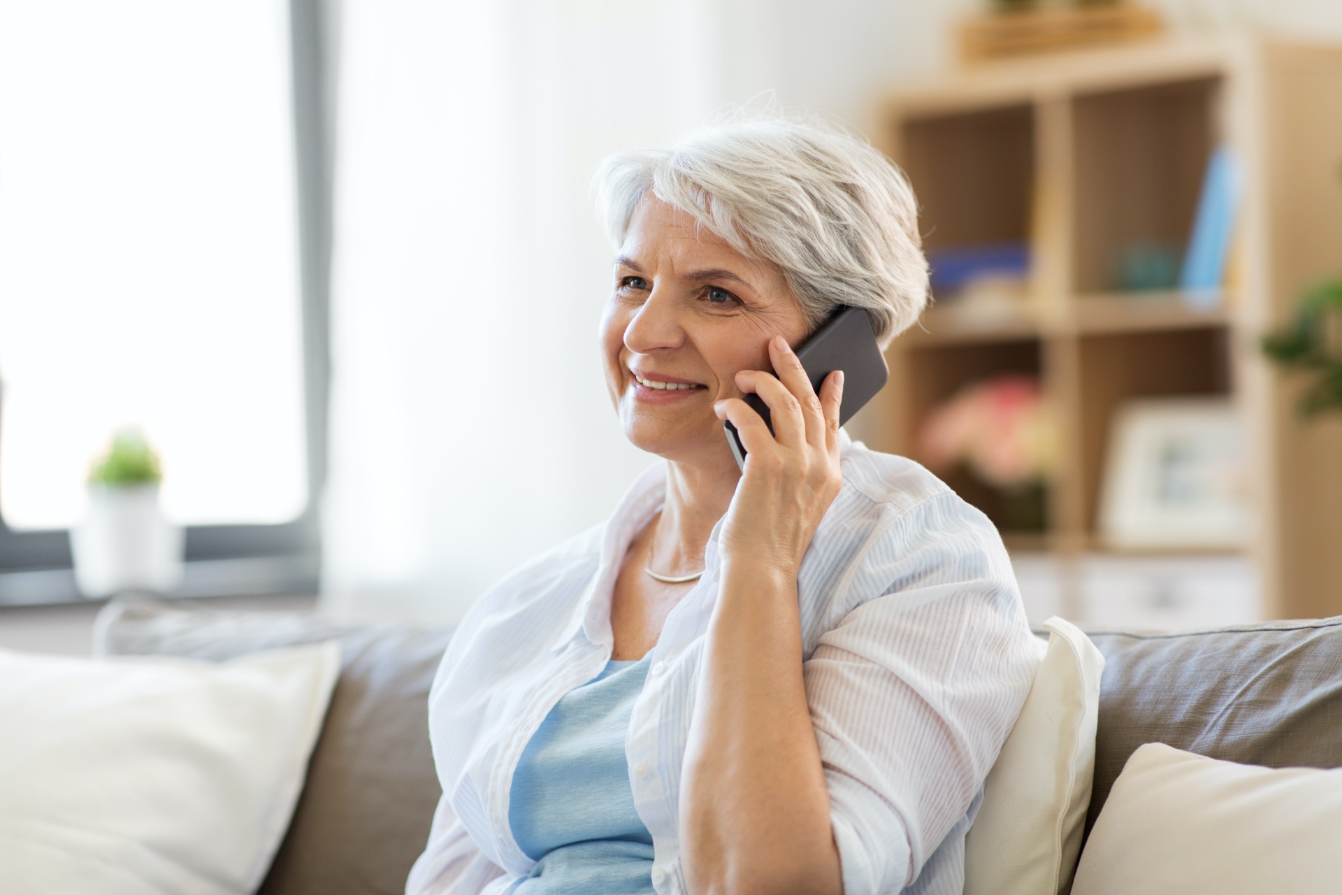 shutterstock_1132144967 Older woman calling about getting a free water test